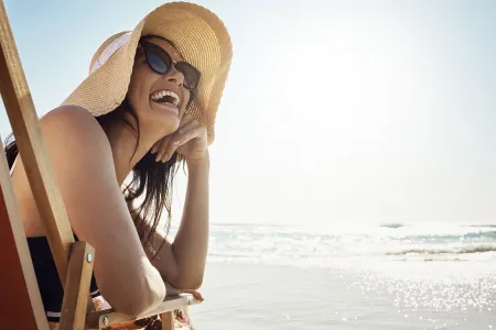 Woman under the sun with a hat